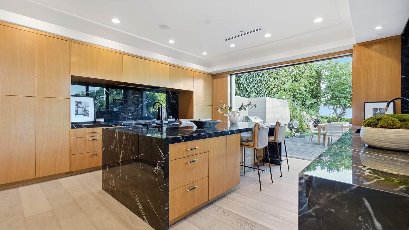 Chef's kitchen with stone island